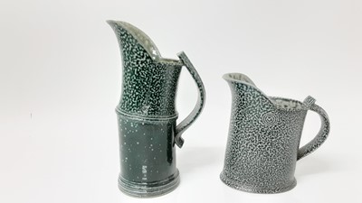 Lot 1190 - Two Walter Keeler studio pottery salt glazed jugs, 24cm high and 16cm high