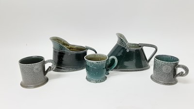 Lot 1191 - Pair of Walter Keeler studio pottery salt glazed mugs, 8cm high, another similar, together with two vessels (5)