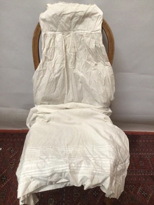Lot 2154 - A selection of Victorian/ Edwardian babies clothing including four caps, three lace and embroidery Christening gowns, two Christening petticoats, also a girl's cut-out work dress and a plain pettic...