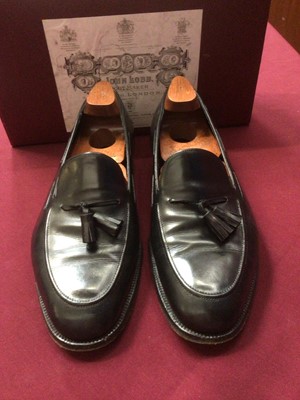 Lot 2163 - A pair of John Lobbs Black leather shoes decribed as Slips on receipt. with shoe trees and original box.