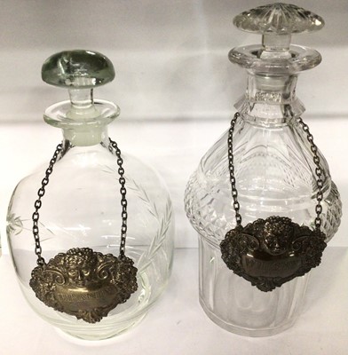 Lot 729 - Georgian cut glass decanter and one other decanter, both with silver spirit labels