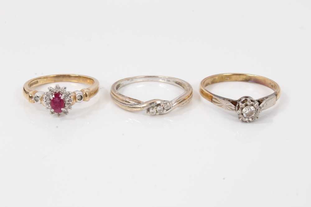 Lot 53 - Diamond single stone ring in platinum setting on 18ct yellow gold shank, together with a 9ct white gold diamond three stone ring and a 9ct gold ruby and diamond cluster ring (3)