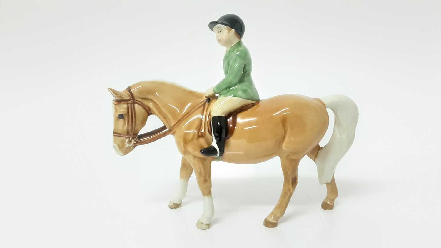 Lot 15 - Beswick Boy on Pony, model no. 1500, designed by Arthur Gredington, 14cm in height