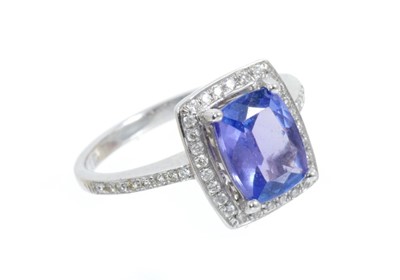Lot 448 - Tanzanite and diamond cluster ring with a cushion shape tanzanite estimated to weigh approximately 1.55cts