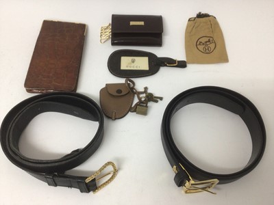 Lot 2179 - Vintage Gucc accessories including black leather belt, leather luggage tag, padlock with leather case and key case. Plus a small Hermes pouch, Asprey Crocodile skin cigar case or  mobile phone case...