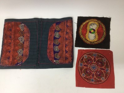 Lot 2184 - A selection of antique Pakistani embroidery items, vibrant silk floss darning stitches and chain stitches on hand woven cotton. Including women's top and top front, tea cosy, pairs of panels...