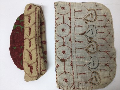 Lot 2184 - A selection of antique Pakistani embroidery items, vibrant silk floss darning stitches and chain stitches on hand woven cotton. Including women's top and top front, tea cosy, pairs of panels...