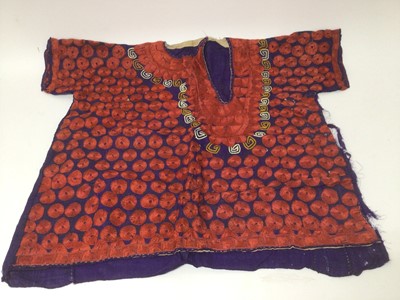 Lot 2184 - A selection of antique Pakistani embroidery items, vibrant silk floss darning stitches and chain stitches on hand woven cotton. Including women's top and top front, tea cosy, pairs of panels...