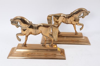 Lot 894 - Pair of antique brass horse fireside ornaments