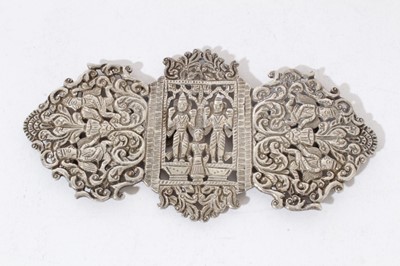 Lot 43 - Thai white metal  buckle with figure and foliate scroll pierced decoration
