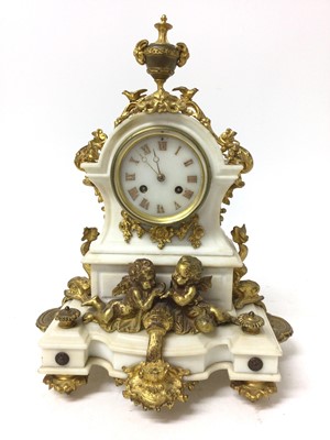 Lot 664 - 19th century mantel clock with French eight day movement and outside countwheel, striking on a bell, white marble dial with applied gold Roman numerals, in a shaped white marble case with rococo gi...