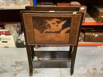 Lot 871 - Early 20th century oak magazine rack with leather panel depicting flying geese, together with a similar leather topped oak stool (2)