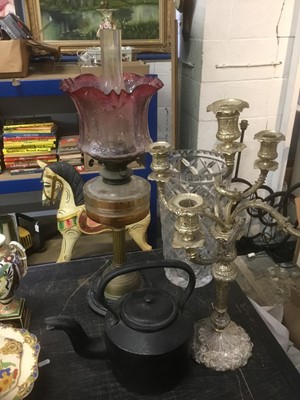 Lot 149 - Brass oil lamp with glass shade, together with a Queen Anne style candelabra, iron kettle
