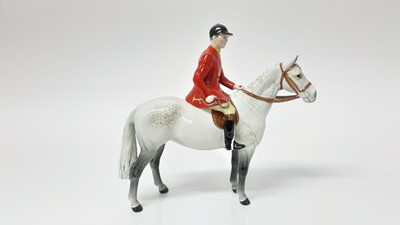 Lot 74 - Beswick Huntsman (style two) model no. 1501, designed by Arthur Gredington, 21cm high, together with two hounds and two foxes (5)