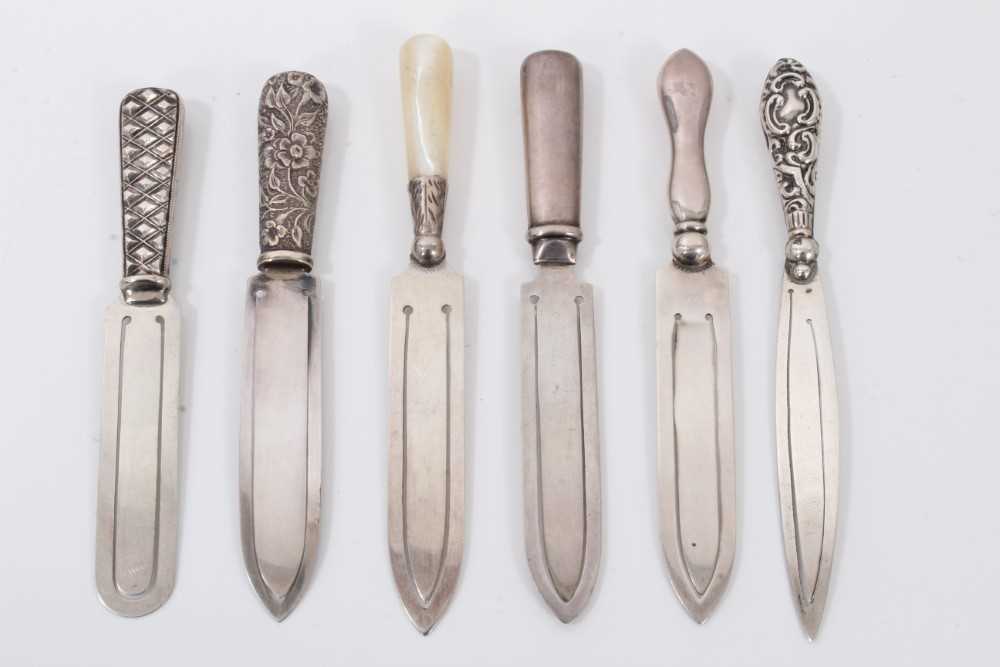 Lot 31 - Six silver bookmarks in the form of knives including one with mother of pearl handle