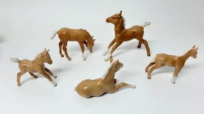 Lot 78 - Five Beswick Palamino Foals including Foal (lying) model no. 915, designed by Arthur Gredington, 8.3cm high