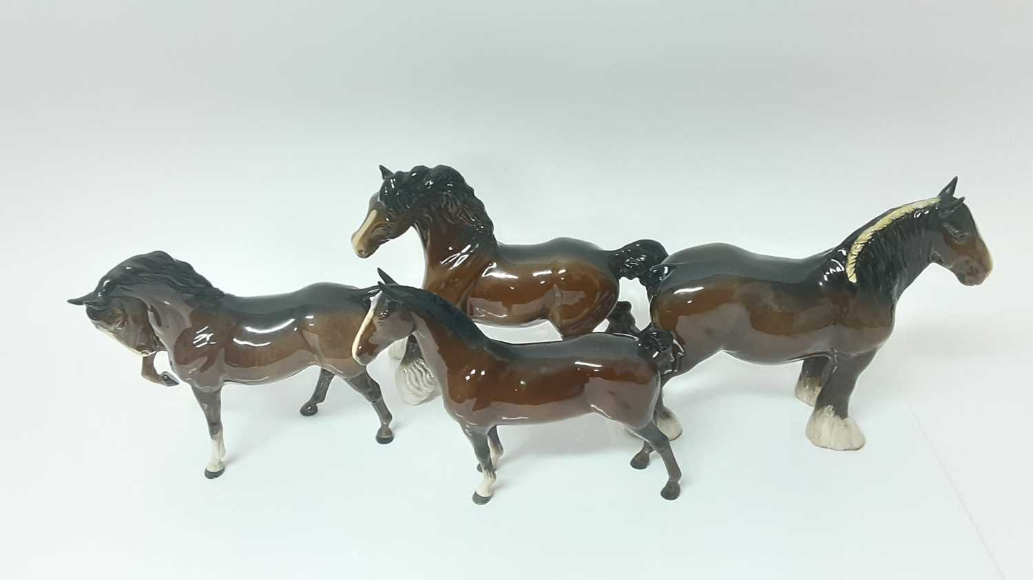 Lot 83 - Four Beswick Horses including Cantering Shire, model no. 975, designed by Arthur Gredington, 22cm high