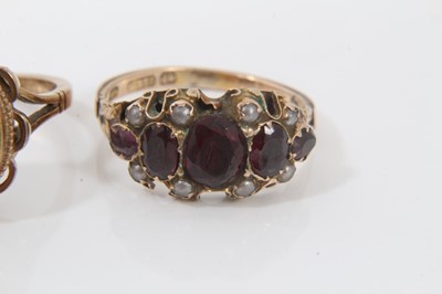 Lot 74 - Antique yellow metal garnet and seed pearl ring, two other 9ct gold garnet rings and yellow metal green hard stone ring (4)