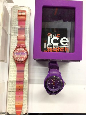 Lot 661 - Swatch watch in case and Ice “forever purple” watch in case