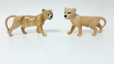 Lot 97 - Three Beswick models - Lion no. 1506, Lioness no. 1507 and Lion Cub no. 1508, all designed by Colin Melbourne, together with another Lion Cub no. 2098, designed by Graham Tongue (4)