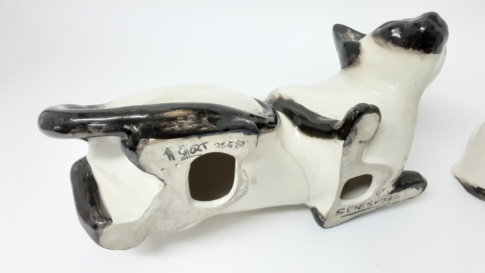 Lot 104 - Five Seneshall pottery cats