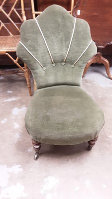 Lot 1095 - Late Victorian nursing chair with scalloped back and green velvet upholstery, one turned mahogany legs and brass castors