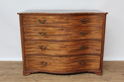 Lot 1469 - George III mahogany serpentine fronted chest of four long drawers with brass handles, on bracket feet