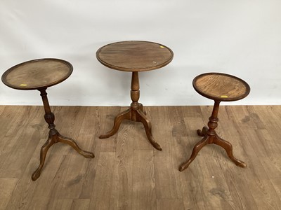 Lot 1031 - Three pedestal wine tables of graduated form with circular tops