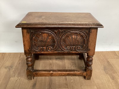 Lot 1029 - Antique-style oak coffin stool with rising lid, carved front and turned supports joined by stretchers