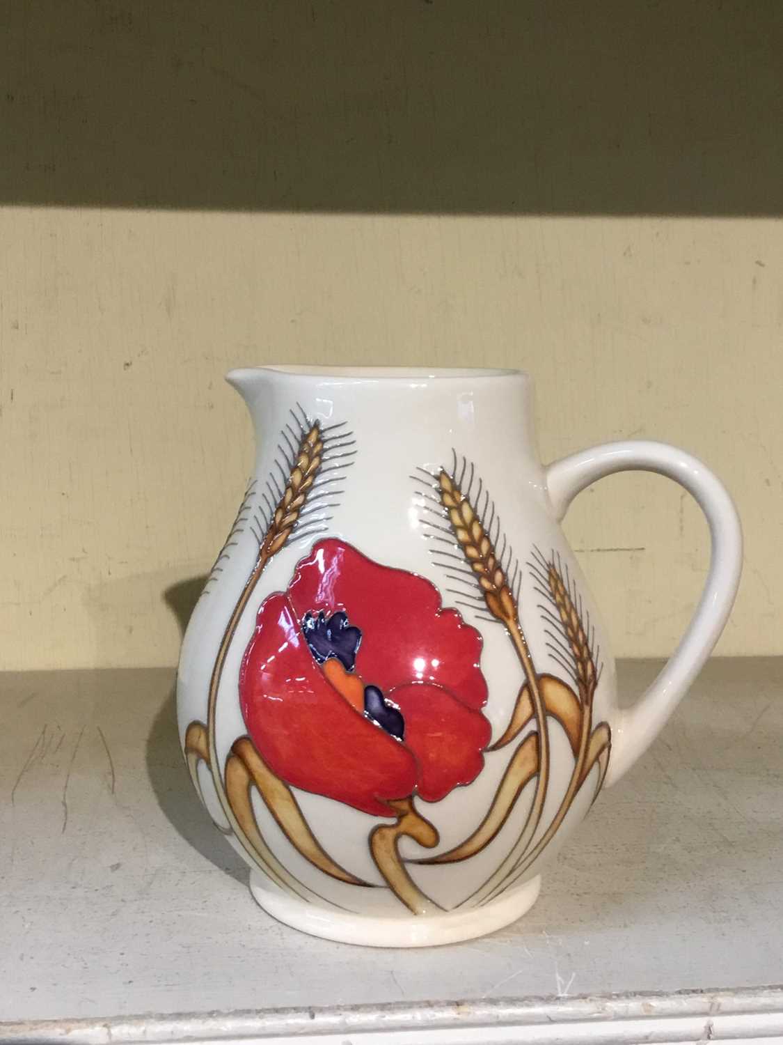 Lot 485 - Moorcroft pottery jug decorated with Poppies