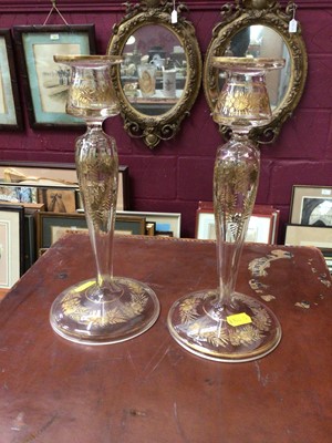 Lot 286 - Pair of Bohemian glass candlesticks, with cut and gilt foliate patterns, 24cm high