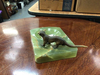 Lot 92 - Onyx dish surmounted by a cold painted otter holding a fish