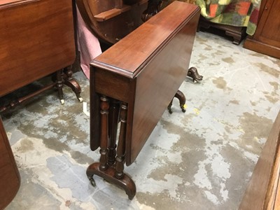 Lot 896 - Victorian mahogany Sutherland table with turned legs on brass casters