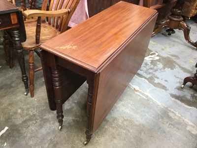 Lot 904 - Victorian mahogany drop leaf dining table on turned legs with brass casters