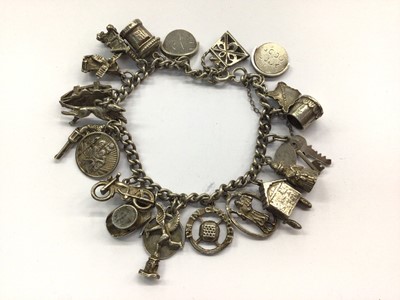 Lot 955 - Silver charm bracelet with silver and white metal novelty charms