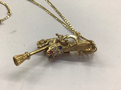 Lot 667 - 9ct gold gem set witch pendant on 9ct gold flat curb link chain