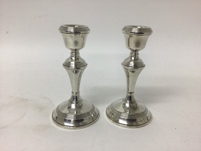 Lot 727 - Pair of sterling silver candlesticks