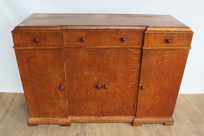 Lot 1443 - Suite of 1930s oak furniture in the manner of Heals, including refectory style table and sideboard