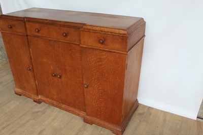 Lot 1443 - Suite of 1930s oak furniture in the manner of Heals, including refectory style table and sideboard