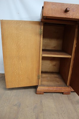 Lot 1443 - Suite of 1930s oak furniture in the manner of Heals, including refectory style table and sideboard