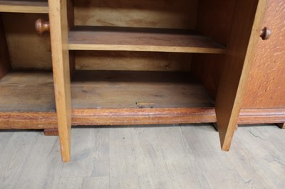 Lot 1443 - Suite of 1930s oak furniture in the manner of Heals, including refectory style table and sideboard