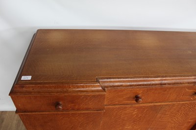 Lot 1443 - Suite of 1930s oak furniture in the manner of Heals, including refectory style table and sideboard