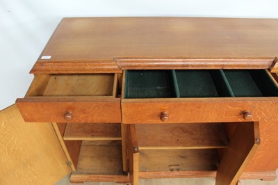 Lot 1443 - Suite of 1930s oak furniture in the manner of Heals, including refectory style table and sideboard