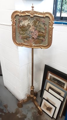 Lot 1079 - Gilt and needlework pole screen