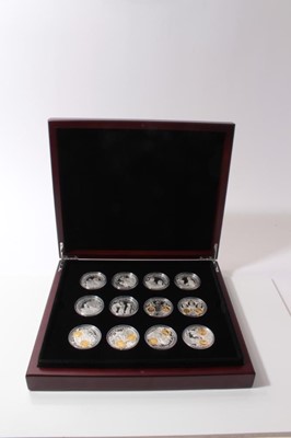 Lot 476 - World - Mixed silver Crowns x 14 UNC in collectors wood case (14 coins)