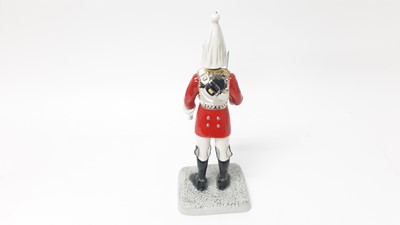 Lot 126 - Royal Doulton Iconic London figure - Lifeguard HN5364,  together with a Royal Doulton dog, and another RoyalDoultonfigure - Teatime HN2255 (3)