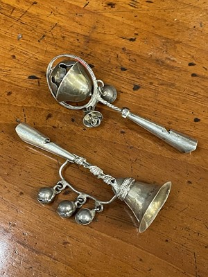 Lot 702 - Two antique white metal babies rattles with whistles