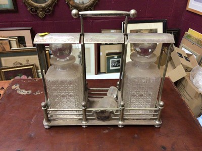 Lot 294 - Edwardian silver plated tantalus with two cut glass decanters