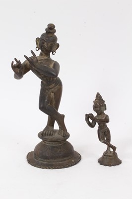 Lot 839 - Antique bronze figure of Lord Krishna, 22cm high, together with another smaller. (2)