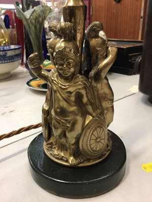 Lot 275 - Victorian brass lamp with three putti dressed as Roman centurions, on painted wooden base